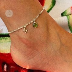 Add a touch of elegance to your feet with this beautiful ankle bracelet. Personalized with an initial or two and birthstone, it allows you to express your unique style. Indeed, this ankle chain is a creation that reflects your personality. Simply choose the material, 925 sterling silver or gold-plated, the initial, and the birthstone. Finally, select the length to ensure this lovely foot chain fits your ankle perfectly. Complete your outfit today with this trendy fashion accessory. It's a must-h Sterling Silver Anklets, Foot Chain, Trendy Fashion Accessories, Sterling Silver Anklet, Ankle Chain, Custom Charms, Summer Gifts, Silver Anklets, Ankle Bracelet