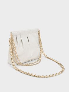 In classic white for maximum style mileage, this match-all version of our Duo shoulder bag is one you will want to wear on repeat. Featuring a seamless magnetic closure that opens up into a roomy interior, this bag is perfectly sized to keep all your daily essentials and then some. With a high-shine gold-tone double chain handle and hardware for added polish, it is the perfect piece to complement off-duty outfits and chic ensembles alike. Off Duty Outfits, Size Chart For Kids, Platform Ankle Boots, Charles Keith, Double Chain, On Repeat, Daily Essentials, Belt Size, White Bag