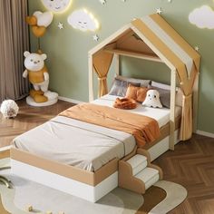 a child's bedroom with green walls and white furniture, including a bed made out of cardboard