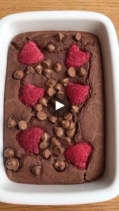 a chocolate dessert with raspberries and chocolate chips