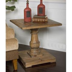 two bottles are sitting on top of a wooden table