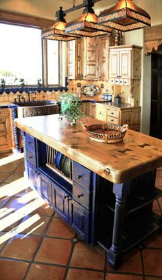 a large kitchen island sitting in the middle of a room