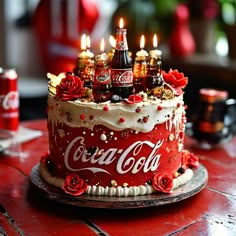 a coca cola cake with candles on top