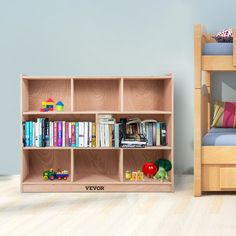 there is a book shelf with many books on it and a bed in the background