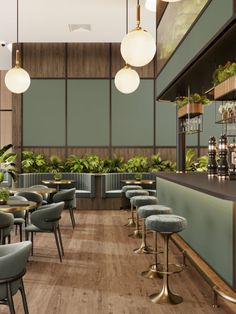 an empty restaurant with green chairs and plants on the bar counter, along with potted plants