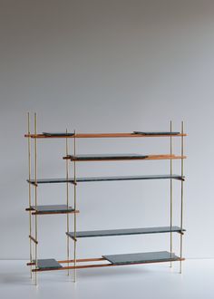 a shelf with three shelves on each side and one shelf holding two bookshelves