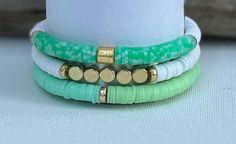 Set of 3 elastic stretch beaded bracelets approx length 6.5" Trendy Green Stretch Bracelet Stackable, Trendy Green Stackable Stretch Bracelet, Adjustable Green Stackable Beaded Bracelets, Adjustable Stackable Green Beaded Bracelets, White Stacked Stretch Bracelet As Gift, White Stacked Stretch Bracelet Gift, Stackable Green Beaded Bracelets As Gift, Green Stackable Beaded Bracelets As Gift, Stretch Beaded Bracelets