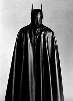 a black and white photo of a batman costume