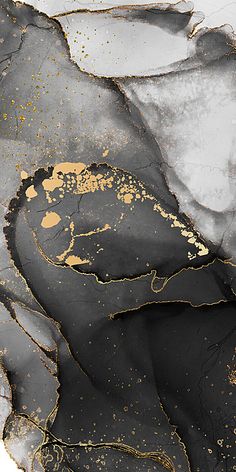 an abstract painting with black and gold paint on it's surface is shown in this image