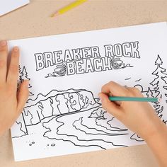 someone is drawing on a piece of paper that says breaker rock beach with trees