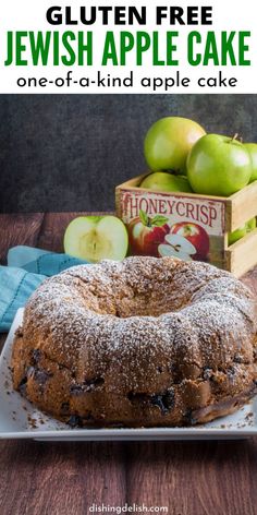 an apple cake on a plate with apples in the background and text overlay reading gluten free jewish apple cake one - of - a - kind apple cake