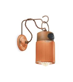 an old fashioned wall light with a rusted metal arm and brown shade on the side