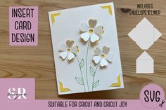 a card with some paper flowers on it