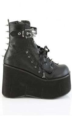 The Kera series features an impressive platform wedge across a range of styles to suit everyone who wants to tower over the competition. Vegan Black PU leather 4 1/2" Inch (114mm) Platform Lace-Up Front Ankle Boot Featuring Top Skull Buckle Strap & Metal Spike Stud Details Inner Side Metal Zip Closure U.S women's sizing-refer to size chart for more info Punk High Ankle Leather Wedge Boots, Punk Style High Ankle Leather Wedge Boots, Leather High Ankle Punk Wedge Boots, Punk High Ankle Wedge Boots With Chunky Platform, Punk Style Chunky Platform Wedge Boots, Edgy High-cut Faux Leather Platform Boots, Faux Leather Wedge Boots With Chunky Platform, High Cut Platform Leather Heels, Edgy High-top Wedge Boots With Chunky Platform