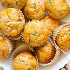 a white plate topped with muffins on top of a table