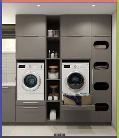 a washer and dryer in a small room with open shelvings on the wall