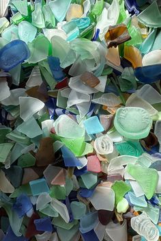 many different colored glass pieces are scattered together