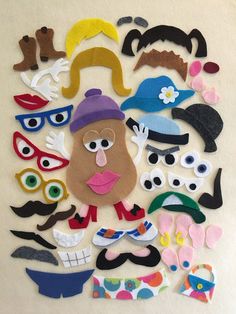 an assortment of paper cut outs with various faces