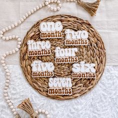 a wicker basket filled with cookies that say one month two months four months six months seven months