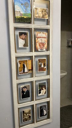 a bathroom with pictures on the wall next to a toilet