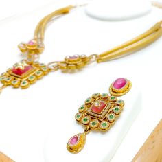 This luxurious set, crafted in 22k gold with an antique finish, weighs 70.3 grams and radiates opulence. The design integrates Kundan stones within its floral motifs, extending over an 18-inch length, complemented by 0.8 inches of adjustable links and a secure hook lock. Accompanied by matching earrings, 2.2 inches in length with screw-back posts, this set epitomizes elegance. Ideal for those seeking a blend of traditional aesthetics and modern sophistication, it's perfect for enhancing any gran Luxury Kundan Necklace With Elegant Design, Luxury Kundan Necklace With Matching Earrings, Traditional 22k Gold Luxury Necklace, Gold Floral Necklace, Floral Necklace, Gold Floral, Floral Motifs, Antique Finish, 22k Gold