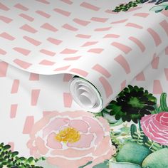 an artistic wallpaper with pink flowers and green leaves on white paper, which is rolled to the side