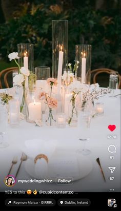 the table is set with candles and flowers