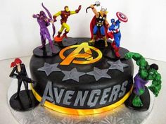 the avengers cake is decorated with various figurines