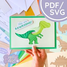 someone is holding up a card that says you are awesome and has an image of a dinosaur on it