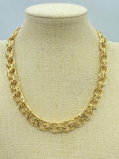 A vintage Trifari chain necklace in a polished gold tone finish. This 90s Trifari necklace is in chunky double links somewhat in the curb chain style. The Trifari gold link necklace closes with a spring ring clasp to a signed oval metal hang tag. It is signed TRIFARI ™. The Trifari gold chain choker length is 17 inches long and 5/8 inch wide. This chain choker weighs a substantial 2.86 ounces. It is in excellent vintage condition without flaws or wear. The Trifari gold chain choker would be such a great addition to any vintage Trifari jewelry collection. Please see the photos and don't hesitate to contact me to ask any of your questions and stop by my shop at VintageByCarolynJoy.etsy.com. SHIPPING AND RETURNS: Items are shipped in a cotton filled kraft or gold foil jewelry box tied with ra 90s Necklace, Gold Link Necklace, Gold Chain Choker, Trifari Jewelry, Vintage Trifari, Gold Link, Chain Choker, Curb Chain, Link Necklace