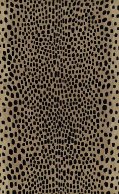 an animal print pattern in black and beige