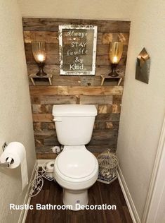 a white toilet sitting in a bathroom next to a wooden wall