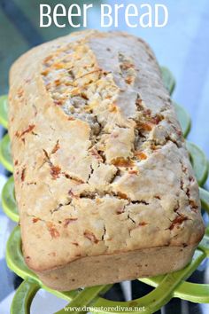 a loaf of beer bread sitting on top of a green plate with text overlay