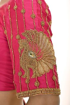 Introducing the Pink Aari Work Bridal Blouse in Pure Silk—a timeless blend of elegance and tradition. Crafted from luxurious pure silk, this stunning bridal blouse features a graceful U-neckline and elegant elbow-length sleeves. The intricate Aari work motifs delicately adorn the blouse, adding a rich and sophisticated touch to your bridal ensemble. Perfect for brides who seek a classic yet refined look, this blouse beautifully complements any saree or lehenga, making it an ideal choice for your special day. Unstitched Blouse With Intricate Embroidery For Reception, Elegant Festive Kundan Blouse Piece, Festive Elegant Kundan Blouse Piece, Festive Zari Work Blouse For Wedding, Festive Blouse With Zari Work For Wedding, Elegant Silk Choli With Resham Embroidery, Formal Art Silk Choli With Zari Work, Silk Traditional Wear With Unstitched Blouse For Reception, Festive Wedding Blouse With Resham Embroidery