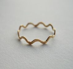 Praying that you have good health and peace.Despite current world conditions I am still open, plugging away, creating and shipping jewelry.I handcraft this ring from 14K gold filled wire. It has a rounded zigzag pattern. The bumps are hammered to give it a finished look. It plays the role of being simple and sweet, and plays it well. ------------------------------MATERIALS: 14k gold filled---------------------------------SIZES: US 1-16Pick your size from the drop down menu or include it in the m Wavy Ring, Zigzag Pattern, Small Rings, Girly Jewelry, Dream Jewelry, Favorite Rings, Gold Filled Jewelry, Pretty Jewellery, Stackable Rings