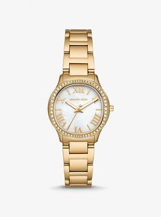 Designed with an iridescent mother-of-pearl face illuminated by glittering pavé accents, this shrunken-down version of our coveted Sage watch is timeless. Crafted from gold-tone stainless steel, it features Roman numeral indexes for precise timekeeping and a dainty casebody that makes it easy to stack with complementing bracelets. Michael Kors Gold Watches For Formal Occasions, Michael Kors Gold Diamond Watch With Round Dial, Michael Kors Gold Watch With Metal Dial, Gold Michael Kors Watches With Diamond Hour Markers, Michael Kors Gold Diamond Watch With Metal Dial, Michael Kors Gold Watches With Diamond Hour Markers, Michael Kors Gold Diamond Watch For Formal Occasions, Michael Kors Timeless Diamond Watch With Diamond Hour Markers, Michael Kors Timeless Diamond Watch