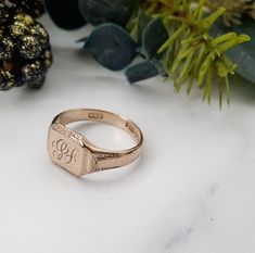 Vintage 9ct Gold Signet Ring.The gold has a lovely slight rose tint to it.Hallmarked London 1953, Makers Mark WWLtdCurrently has a monogram of SF engraved on the front. This can be left as it is or polished off and left plain. Please see example before and after image.  Size W (EU 63, US 11). Free Resizing Available - please message or email info@sobellejewellery.comWeight: 5.5gFront: 12mm x 10mmShoulders: 5mmBack: 3mmCondition:  Good, clean vintage condition. All items will have a full professi Formal Hallmarked Rose Gold Engraved Ring, Formal Rose Gold Engraved Ring Hallmarked, Formal Rose Gold Engraved Ring With Hallmark, Classic Engraved Hallmarked Rose Gold Ring, Classic Engraved Wedding Ring With Hallmark, Classic Rose Gold Initial Ring, Hallmarked Rose Gold Signet Ring For Wedding, Hallmarked Engraved Rose Gold Ring, Victorian Hallmarked Rose Gold Signet Ring