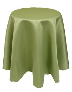 a round table with a light green cloth on it's top and an empty white background