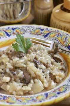 a close up of a plate of food with rice and mushrooms