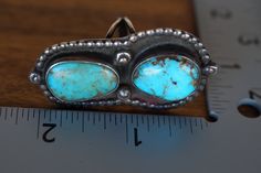 A huge stunning old pawn ring. Large bezel set Royston blue and green turquoise cabs crown the shadow field trimmed in sterling beads. Top quality Unkown pen etched initials RC LK -- possibly Kallestewa family Size 9 54 mm x 30 mm 20.6 grams Royston Turquoise, Green Turquoise, Turquoise Sterling Silver, Bezel Setting, Rings Statement, Sterling Silver Ring, Statement Rings, Silver Ring, Sterling Silver Rings