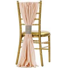 a gold chair with a pink sash draped over it