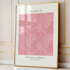 a pink and gold framed print with the words, palm 23