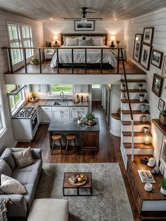 this is a loft with stairs leading to the upper floor and second story bedroom above it