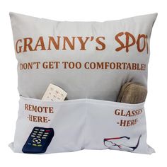 a pillow that has some remotes in it and the words granny's spot don't get too comfortableable