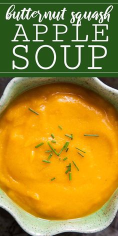 butternut squash apple soup in a white bowl with green sprigs on top