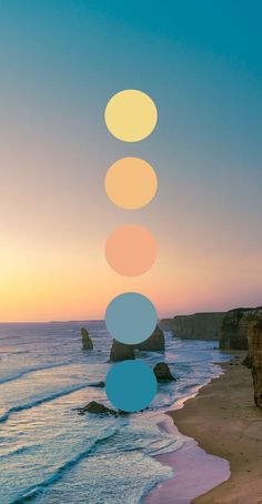 a person standing on the beach next to an ocean with five circles in front of them