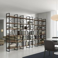 a dining room table and chairs in front of a bookshelf