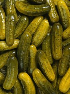 cucumbers are piled up in a pile