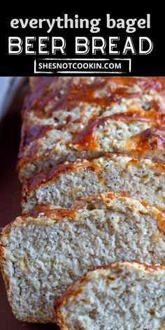 there is a loaf of beer bread on the table with text overlay that reads everything bagel beer bread