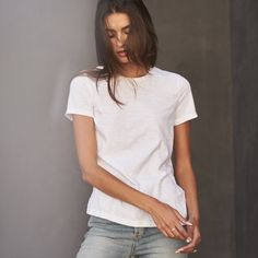 Get $30 off by adding any 3 tees or tanks to your cart. Discount automatically applied at checkout. Introducing a longer body variation on our best-selling Tyler Tee in a 100% cotton slub. Carrying over the same fit, crew neck and straight hem as our classic Tyler, we’ve added 2 inches in length. Slub cotton is made from yarn that is twisted with variable tensions to create uneven highs and lows in a subtle horizontal striping and a luxurious lofty yet breezy texture. Our Heritage Wash process i Long Torso, Winter 2022, Boyfriend Tee, Chambray Shirt, Cropped Denim, Quality T Shirts, Crew Neck Tee, V Neck Tee, Bottoms Pants